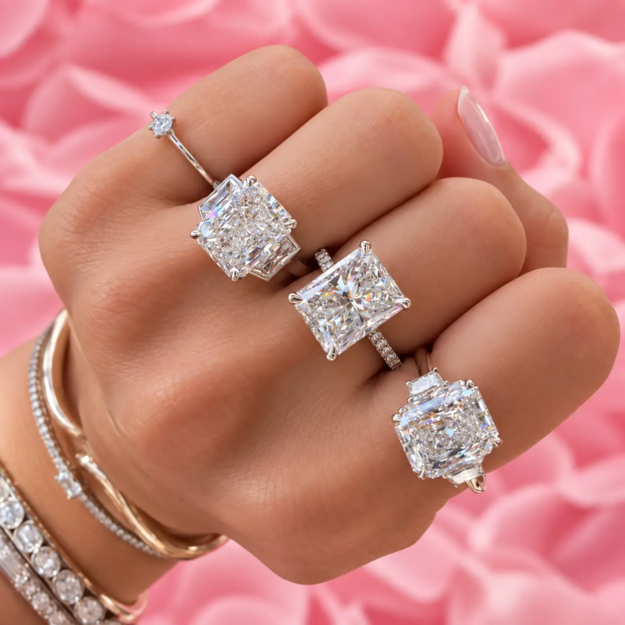 Radiant-cut diamond rings in graduated sizes